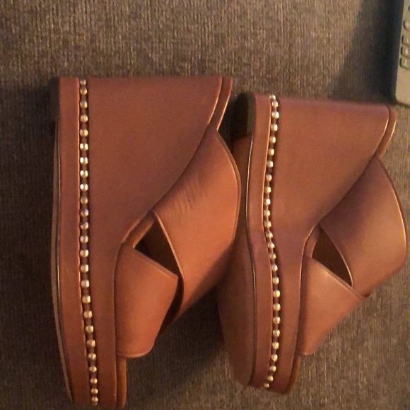 Coach leather slip in shoes.  I am a 7.5 and they fit me and are so comfortable! - Picture 6 of 7